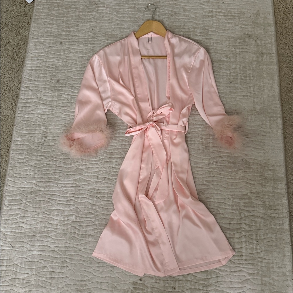 silky smooth pink feather robe with waist tie
one size